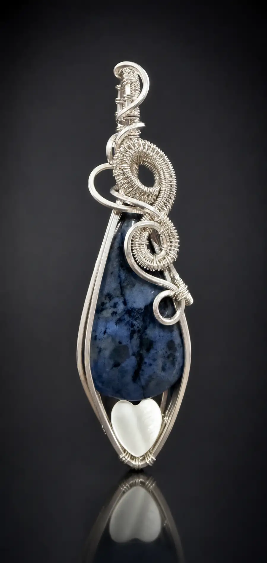 Wire-wrapped dumortierite pendant with a small heart stone set in coiled sterling silver